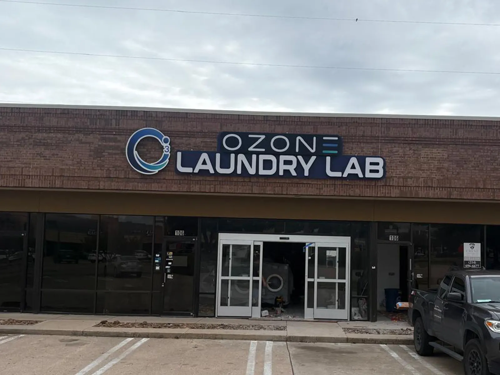 Ozone Laundry Lab channel letters and logo above a laundromat storefront