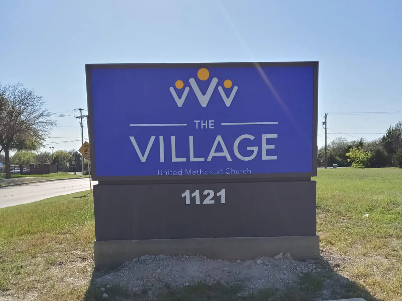 The Village United Methodist Church monument sign with address numerals