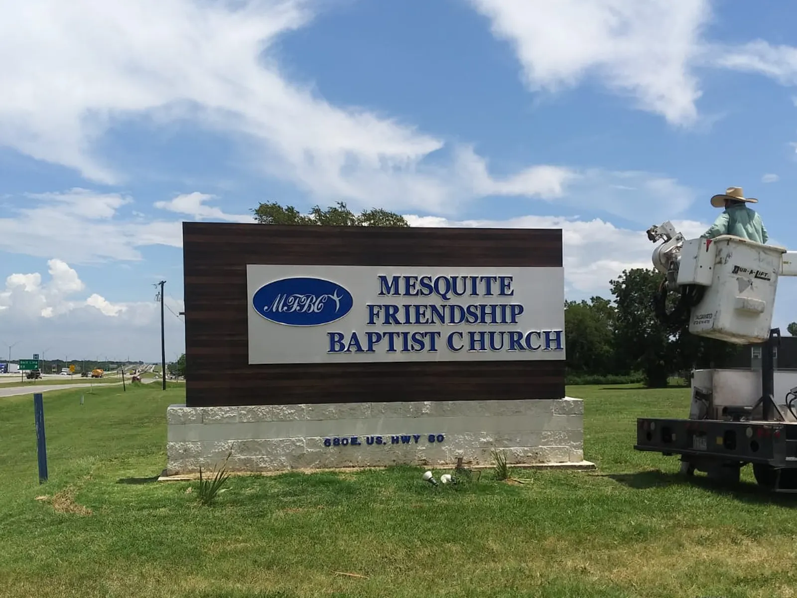 Mesquite Friendship Baptist Church roadside monument sign with an installation truck on site